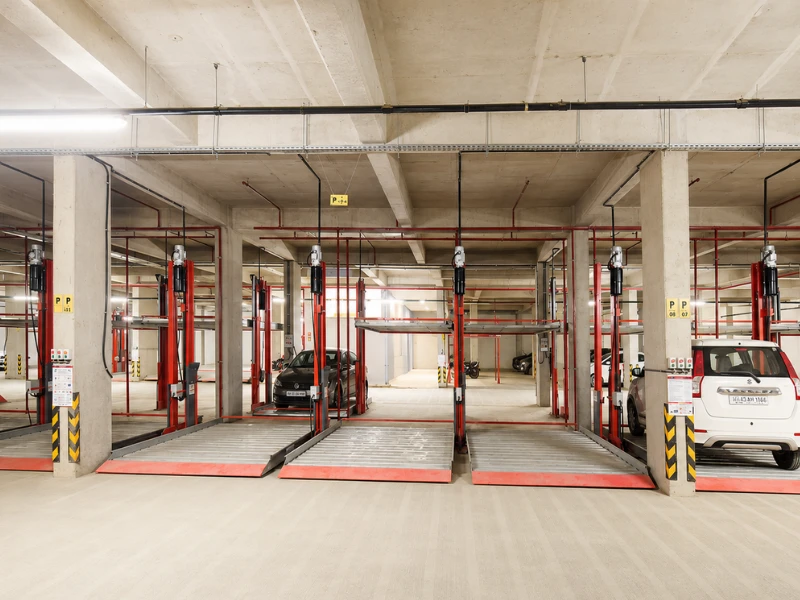 i-CUBE mechanical car parking elevator system installed in an indoor basement parking area with multiple parking platforms