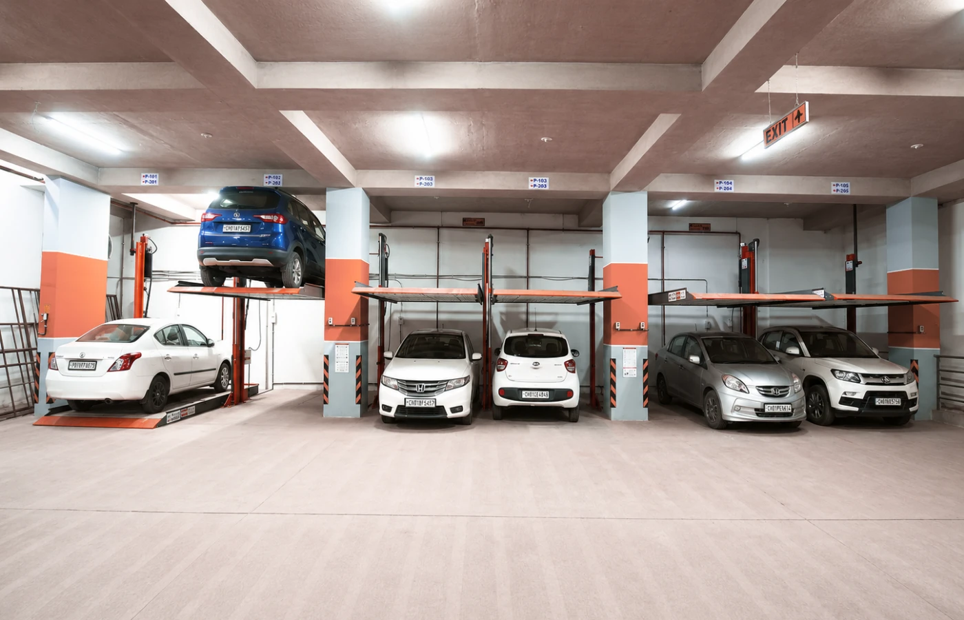 i-CUBE automated car parking system with hydraulic car parking elevators inside a modern indoor basement parking facility in India