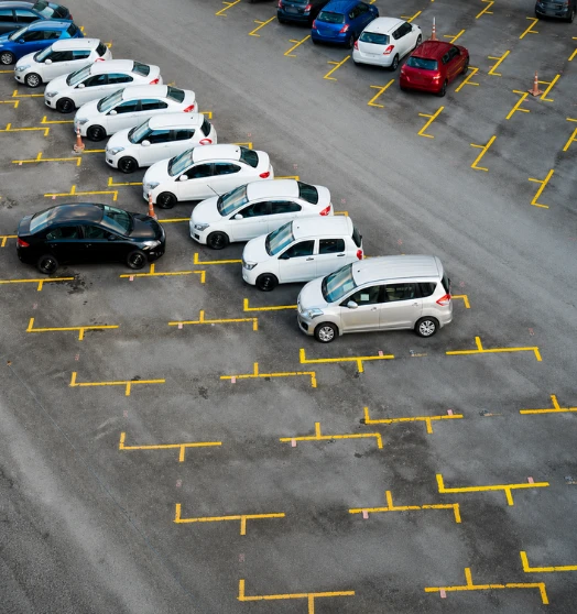 Aerial view of a car parking lot planned by parking consultants in India.