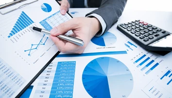 Financial charts and calculator used to evaluate parking revenue models and project feasibility.